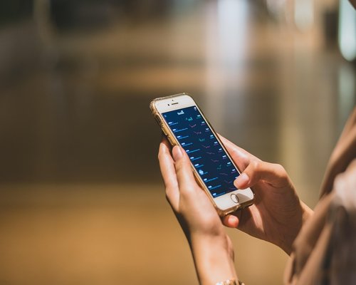 A person securely managing digital payment habits on a smartphone app